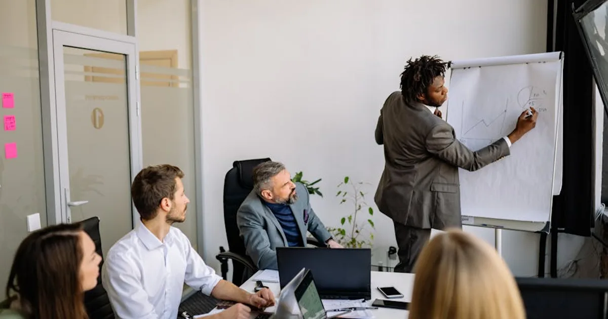 business team meeting strategy, illustrating AI Chatbots vs. Cold Outreach: Automating B2B Lead Generation in 2026